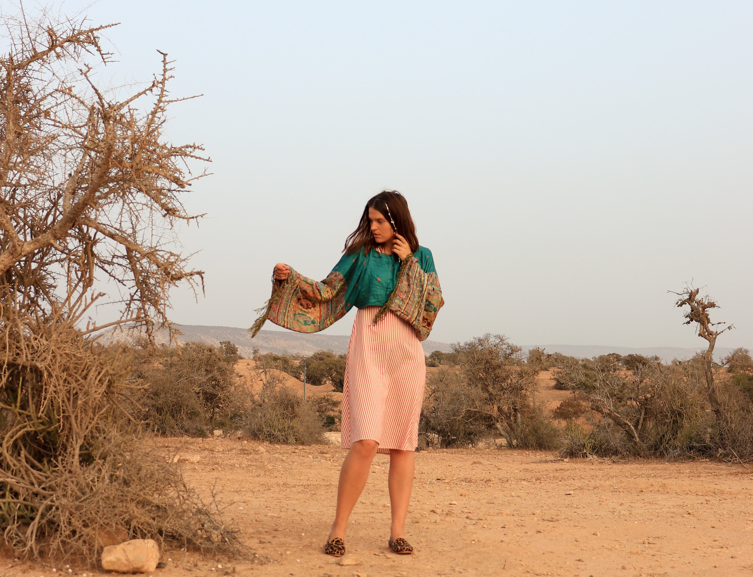 woman in a dessert climate wearing pashmina top
